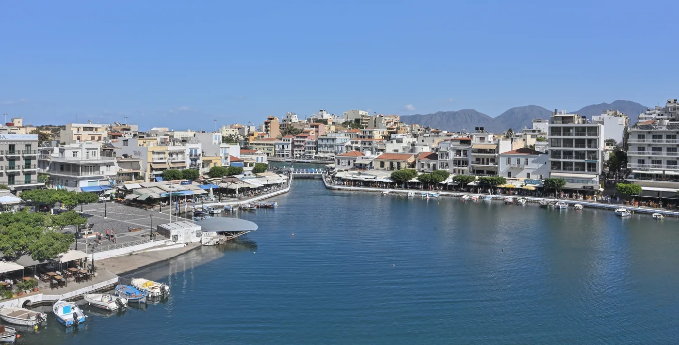 Lake Voulismeni in Agios Nikolaos, with the town rising around its deep water.